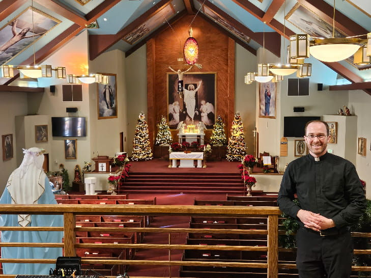 Fr Matt inside the church.jpg